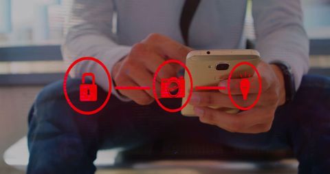 Businessperson Using Smartphone with Digital Security Graphics