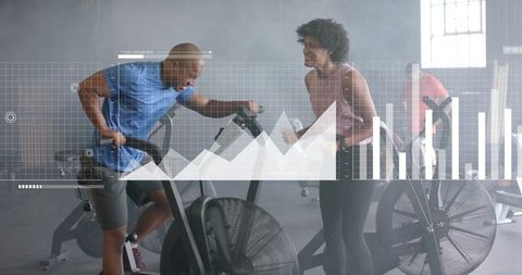 Diverse couple engaged in high-intensity workout with digital data overlay