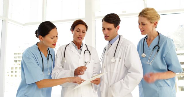 Medical team discussing a file at the hospital