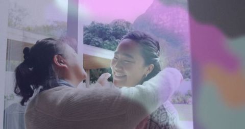 Warm Family Embrace by Glass Door at Home's Entrance