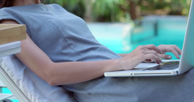 Businesswoman Working Remotely by Outdoor Pool - Download Free Stock Images Pikwizard.com