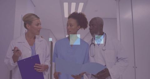 Medical Staff Collaborating in Hospital Corridor