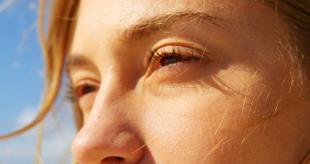 Close up of caucasian woman with brown eyes on beach. Summer, leisure, vacation and lifestyle, unaltered.