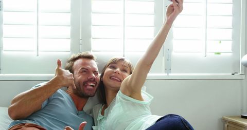 Midlife Couple Enjoying a Joyful Selfie Moment Together