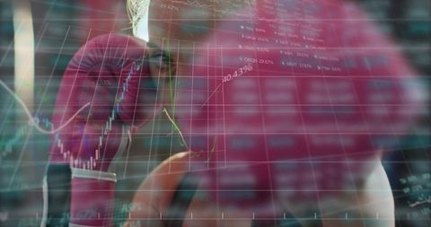 Punching through market volatility: female boxer training with stock chart double exposure
