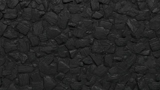 Anthracite coal texture close-up filling frame rugged charcoal surface industrial background