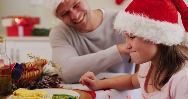 Father and Daughter Celebrating Christmas Dinner with Santa Hats - Download Free Stock Images Pikwizard.com