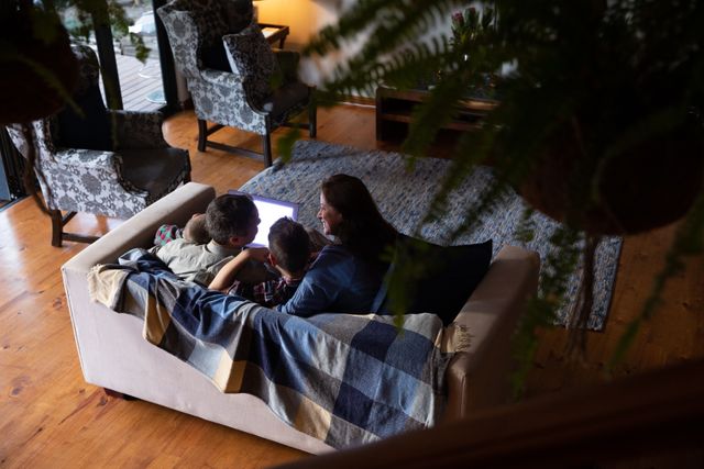 Family Bonding Time on Sofa with Laptop - Download Free Stock Photos Pikwizard.com