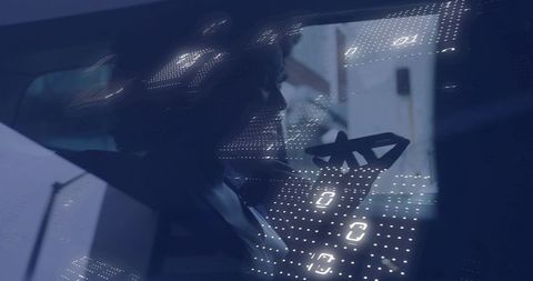 Moody woman silhouette in car window reflecting LED dot grid, urban night travel emotion