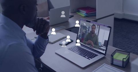 Senior Worker Engaging in Virtual Meeting for Enhanced Collaboration