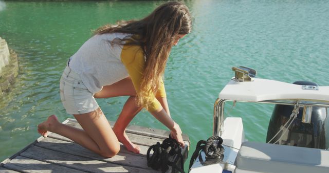 Young Woman Docking Boat on Sunny Day - Download Free Stock Images Pikwizard.com