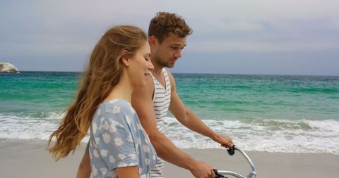 Happy Couple Enjoying Beach Walk with Bicycle - Download Free Stock Images Pikwizard.com