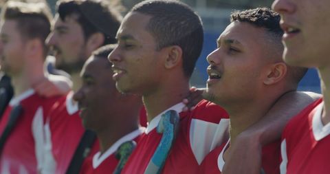 Diverse Male Hockey Team Celebrating Outdoor Win Together