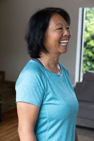 Senior Woman Embracing Wellness in Casual Home Environment