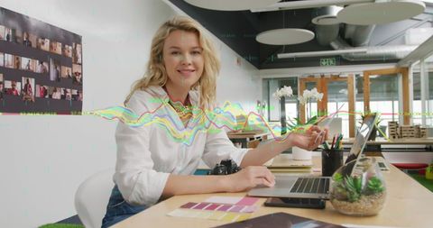 Businesswoman analysing data in modern office