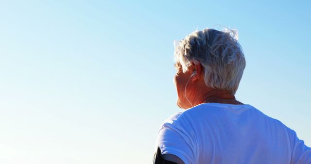 Senior Man Enjoying Outdoor Exercise Under Clear Blue Sky - Download Free Stock Images Pikwizard.com