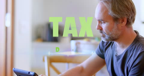 Man Tax Preparation Home Tablet Technology Focused Work