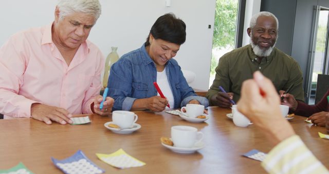 Senior Friends Enjoying Coffee and Games Together at Community Center - Download Free Stock Images Pikwizard.com