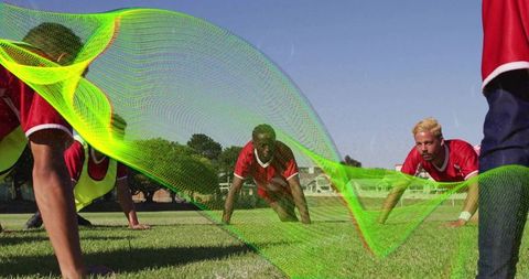 Dynamic team conditioning plank drill with neon motion overlay on outdoor grass field