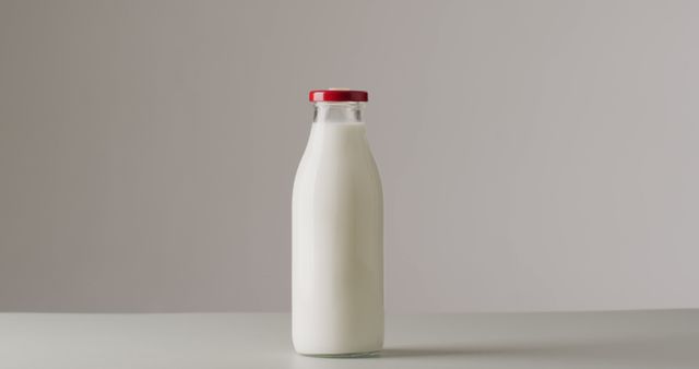 Glass Milk Bottle with Red Cap on Light Background - Download Free Stock Images Pikwizard.com