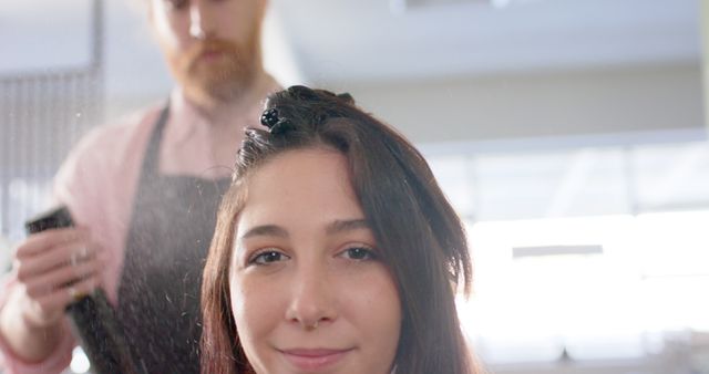 Hairdresser Spraying Product on Female Client's Hair - Download Free Stock Images Pikwizard.com