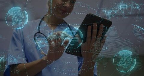 Clinician tapping tablet and viewing holographic global network for telemedicine care