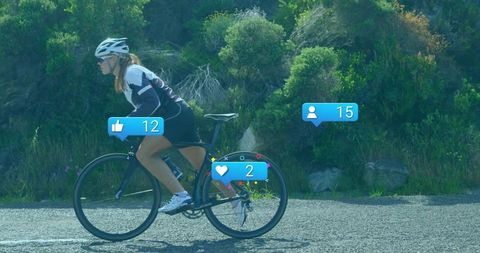 Female Cyclist Riding on Scenic Road with Social Media Icons