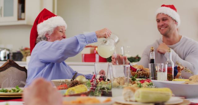 Family Celebrating Christmas Dinner with Laughter and Lemonade - Download Free Stock Images Pikwizard.com