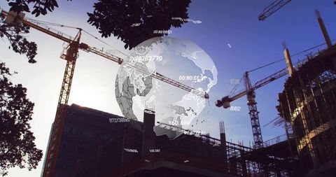 Digital Globe Overlay Hovering Above Urban Construction Site with Tower Cranes at Sunset