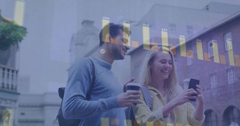 Young Professionals Engaging in Technology Over Coffee in Urban Setting