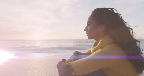 Contemplative Woman Watching Serene Ocean Sunset