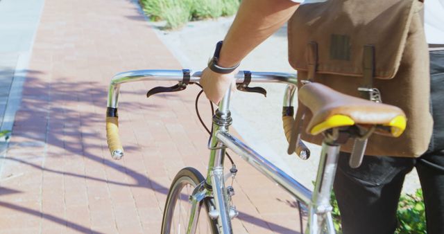 Person Walking with Vintage Bicycle on Brick Path - Download Free Stock Images Pikwizard.com