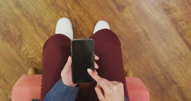 Person Using Smartphone in Hands with Wooden Floor Background - Download Free Stock Images Pikwizard.com