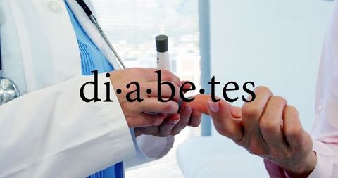 Medical professional checking blood sugar with glucometer