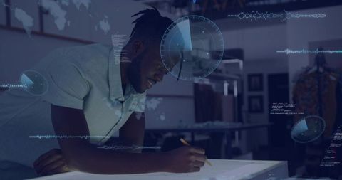 Designer sketching fashion concepts at illuminated drafting table with HUD data overlays