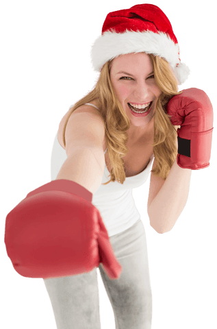 Playful woman with boxing gloves and santa hat on transparent background