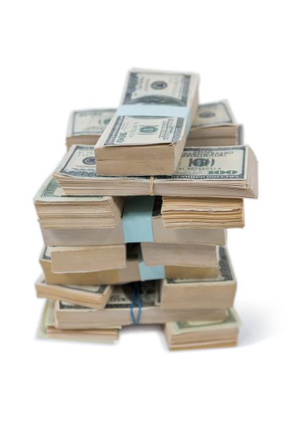 This image shows a stack of US hundred dollar bills bundled together on a white background. It can be used for financial and banking themes, illustrating wealth, savings, investment, or economic concepts. Ideal for websites, advertisements, and articles related to finance, business, and economic success.