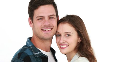 Happy young couple embracing in close pose