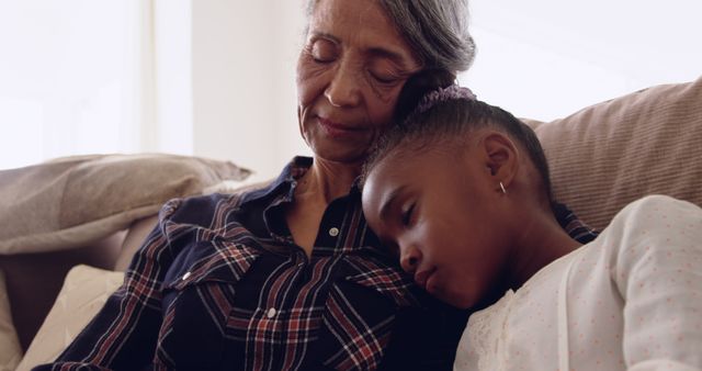 Grandmother and Granddaughter Enjoying Peaceful Nap on Couch - Download Free Stock Images Pikwizard.com