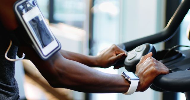 Person Exercising on Treadmill with Fitness Tracker and Arm Phone Holder - Download Free Stock Images Pikwizard.com