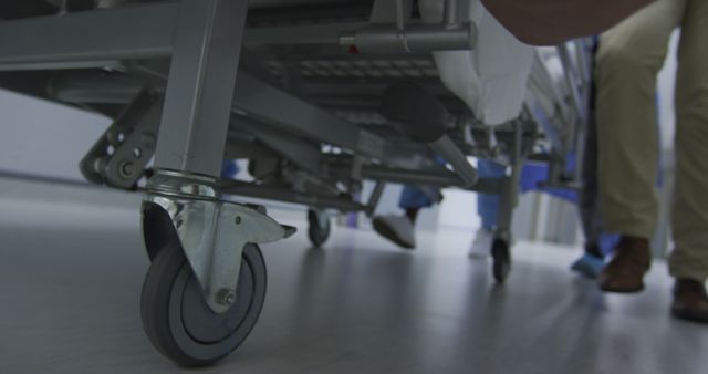 Hospital Staff Pushing Patient Bed Down Hallway - Download Free Stock Images Pikwizard.com