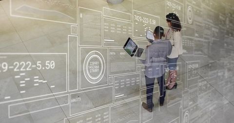 Business team collaborating with augmented reality dashboards in modern atrium workspace