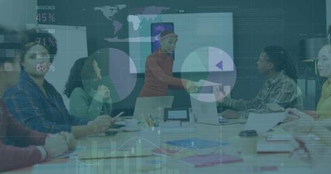 Diverse team presenting data-driven strategy in boardroom with charts and laptops