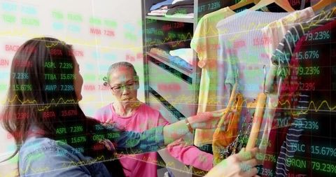 Customers selecting clothing in boutique with financial data overlay retail analytics