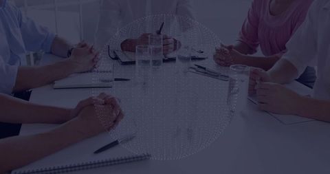 Business professionals collaborate in formal meeting setting