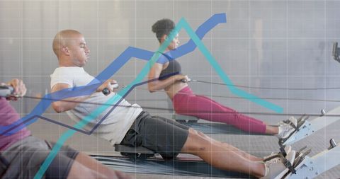 Diverse Group Training on Rowing Machines with Data Graph Overlay - Download Free Stock Images Pikwizard.com