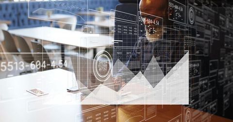 Mature professional analyzing financial dashboard on laptop in modern coworking hub