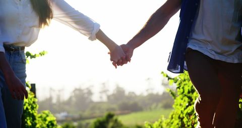 Romantic Young Couple Holding Hands at Sunset Outdoors - Download Free Stock Images Pikwizard.com