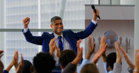Successful Business Executive Celebrating Achievements with Forum Applause - Download Free Stock Images Pikwizard.com