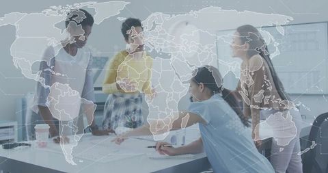 Multicultural team collaborating around meeting table with world map overlay